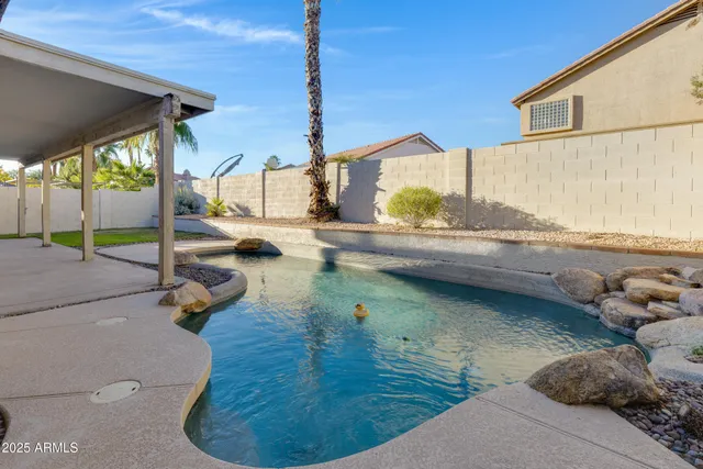 a swimming pool with mountain view
