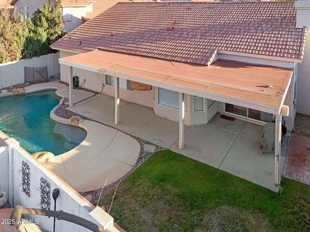 a view of a backyard with sitting area