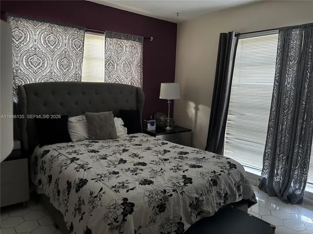 a view of backyard with outdoor seating and plants