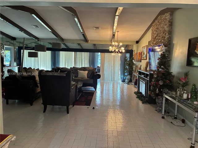 a view of entryway with furniture and wooden floor