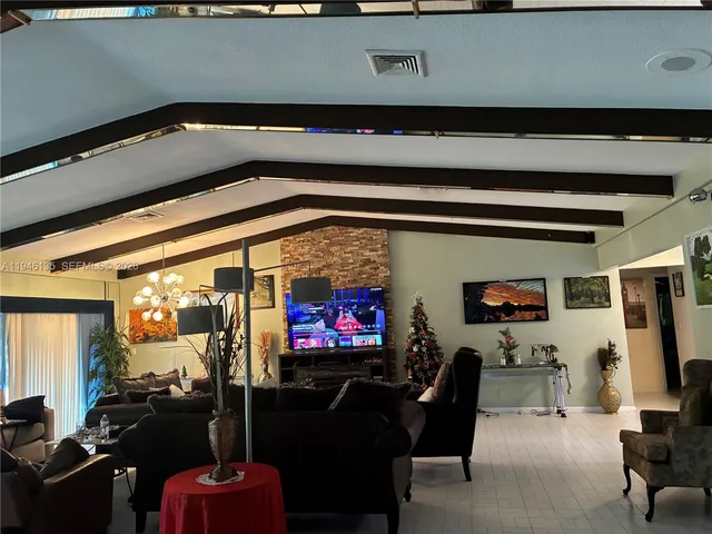 a kitchen with refrigerator a microwave a stove and cabinets