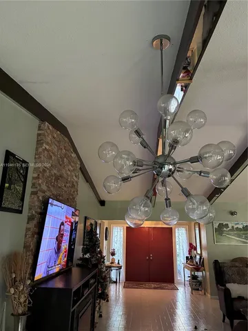a kitchen with stainless steel appliances a refrigerator sink and cabinets
