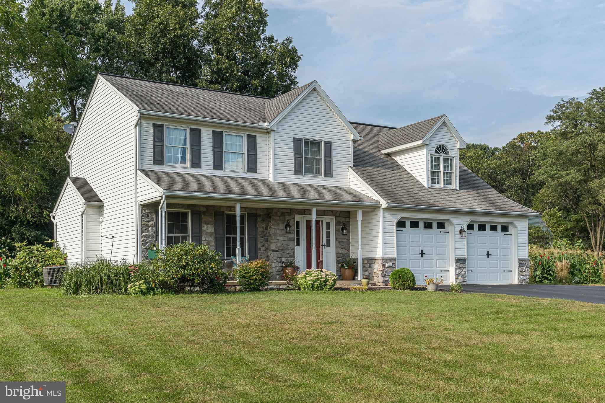 802 Augusta Drive Lititz, PA 17543 - Photo 3 of 47 a front view of a house with a garden
