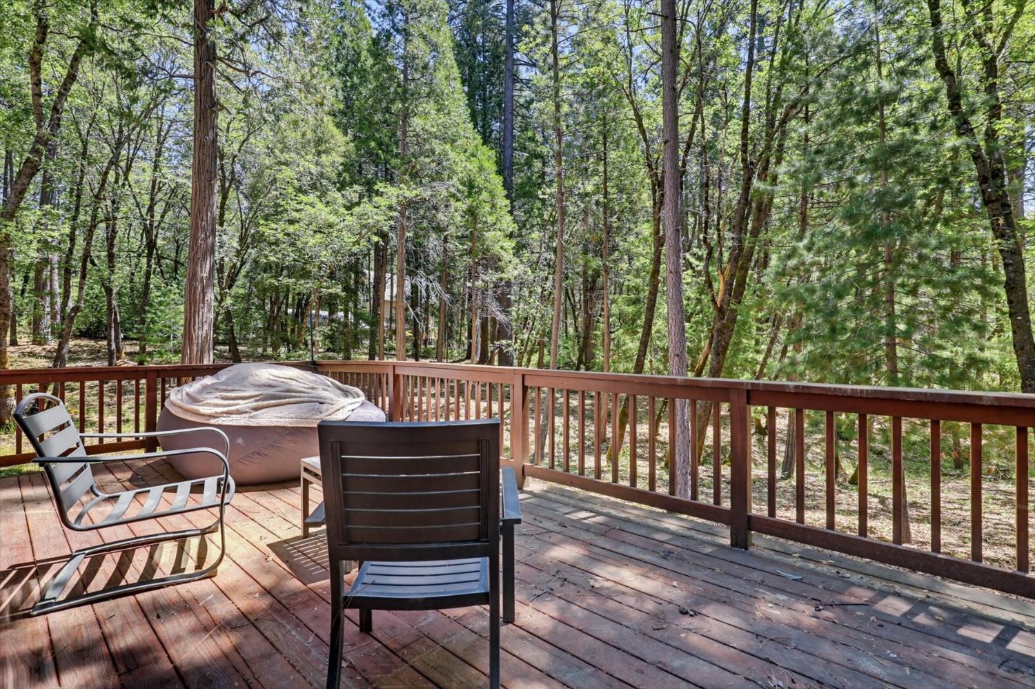 14517 North Bloomfield Road Nevada City, CA 95959 - Photo 67 of 78 a view of a chairs and table on the wooden deck