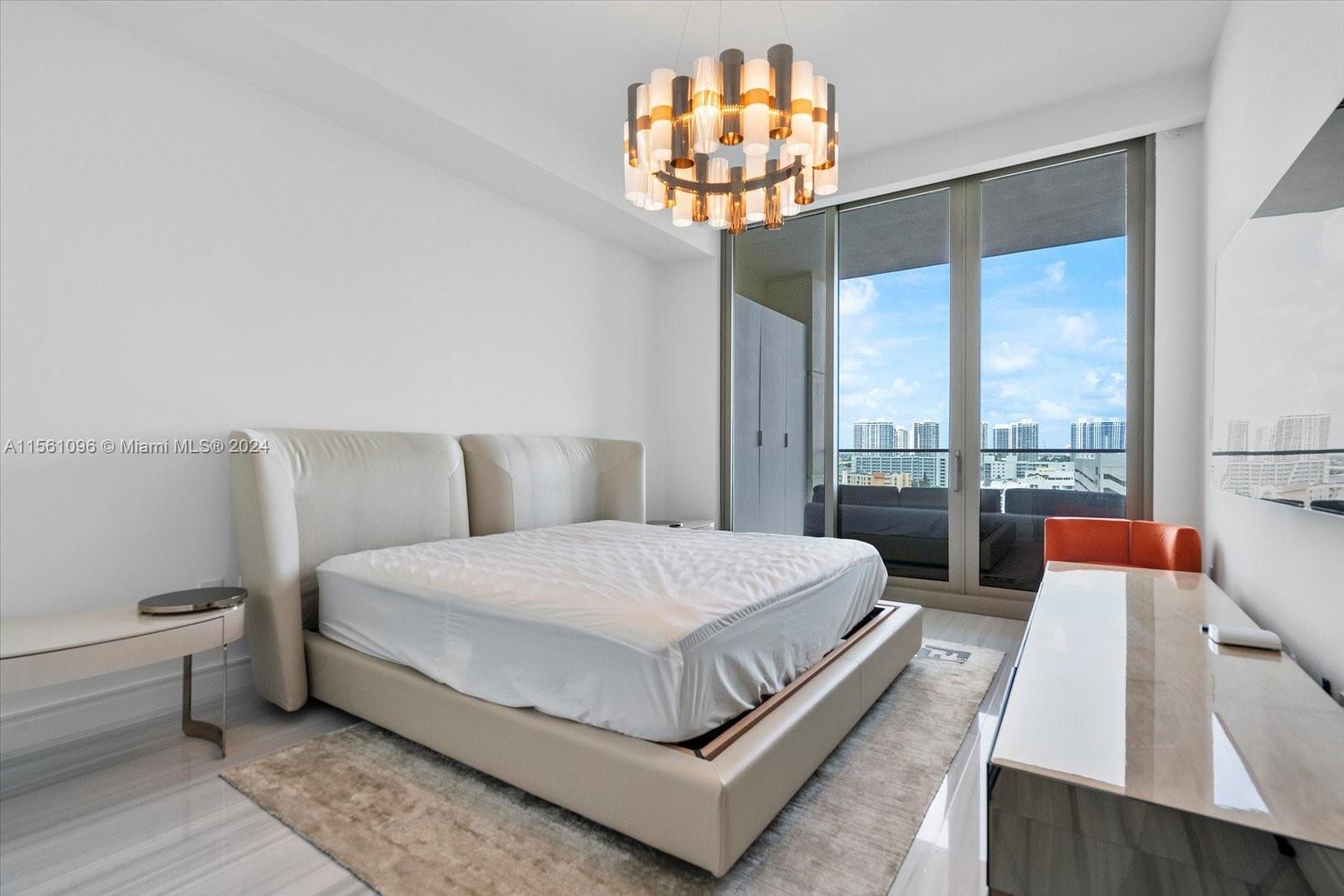 17901 Collins Avenue, Unit 902 Sunny Isles Beach, FL 33160 - Photo 35 of 47 a bedroom with a bed and a large window