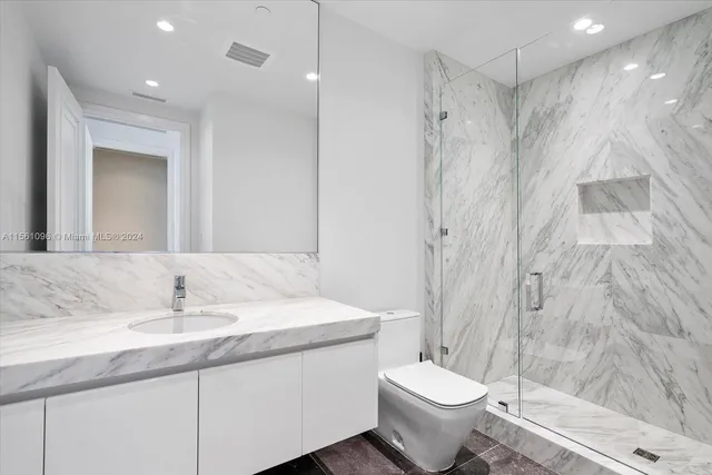 a bedroom with two beds and painting on the wall