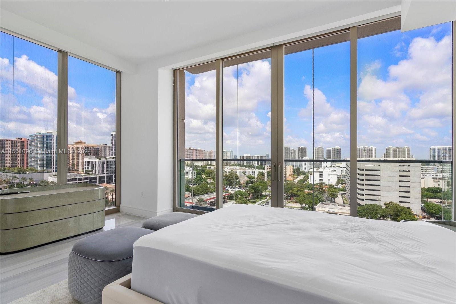 17901 Collins Avenue, Unit 902 Sunny Isles Beach, FL 33160 - Photo 41 of 47 a bedroom with a large bed and a large window
