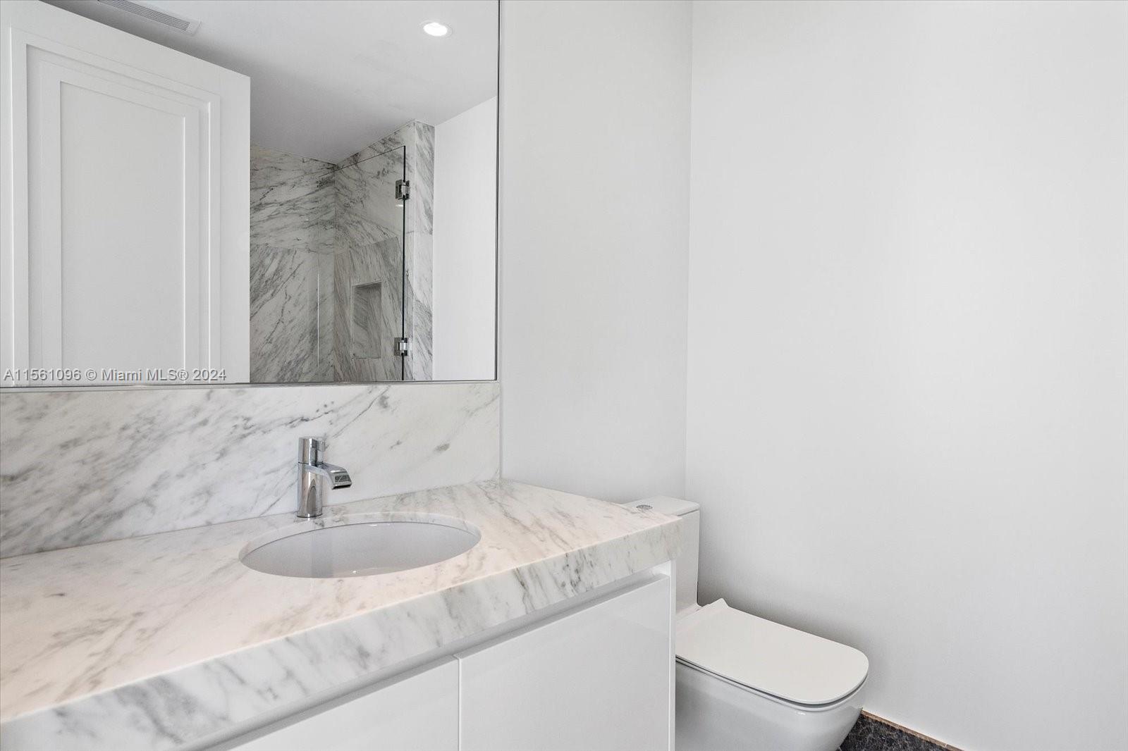 17901 Collins Avenue, Unit 902 Sunny Isles Beach, FL 33160 - Photo 42 of 47 a bathroom with a sink toilet and shower