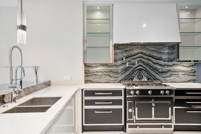 a kitchen with a stove and a sink