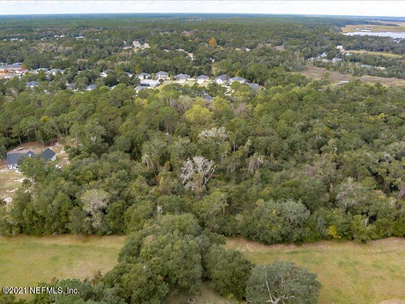 0 Chester River Road Yulee, FL 32097 - Photo 1 of 10 an aerial view of residential houses with outdoor space and trees