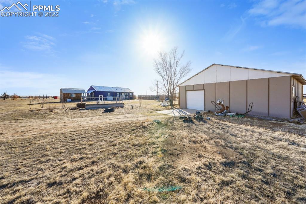 6260 Night Train Lane Yoder, CO 80864 - Photo 11 of 24 a view of a house with a yard and sitting area