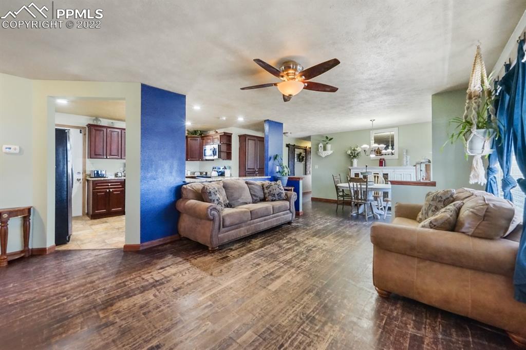 6260 Night Train Lane Yoder, CO 80864 - Photo 13 of 24 a living room with furniture and a large window
