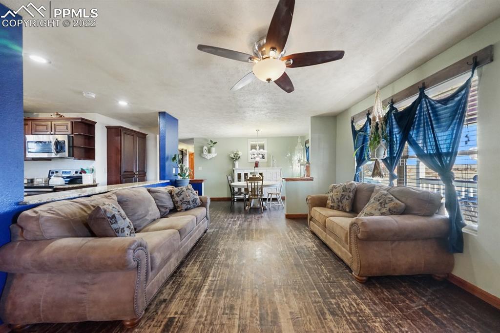 6260 Night Train Lane Yoder, CO 80864 - Photo 14 of 24 a living room with furniture and kitchen view