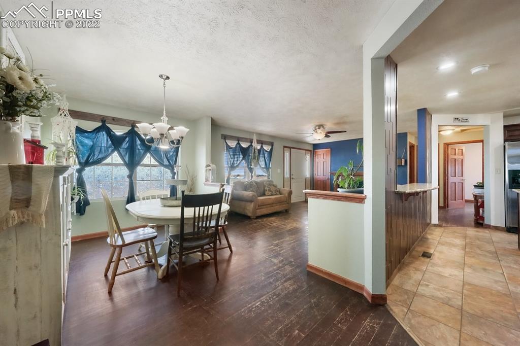 6260 Night Train Lane Yoder, CO 80864 - Photo 18 of 24 a living room with furniture and a wooden floor