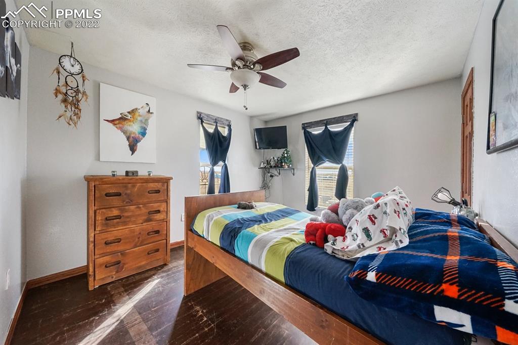 6260 Night Train Lane Yoder, CO 80864 - Photo 24 of 24 a bedroom with a bed and furniture