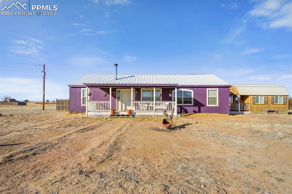 6260 Night Train Lane Yoder, CO 80864 - Photo 4 of 24 a view of a house with a patio