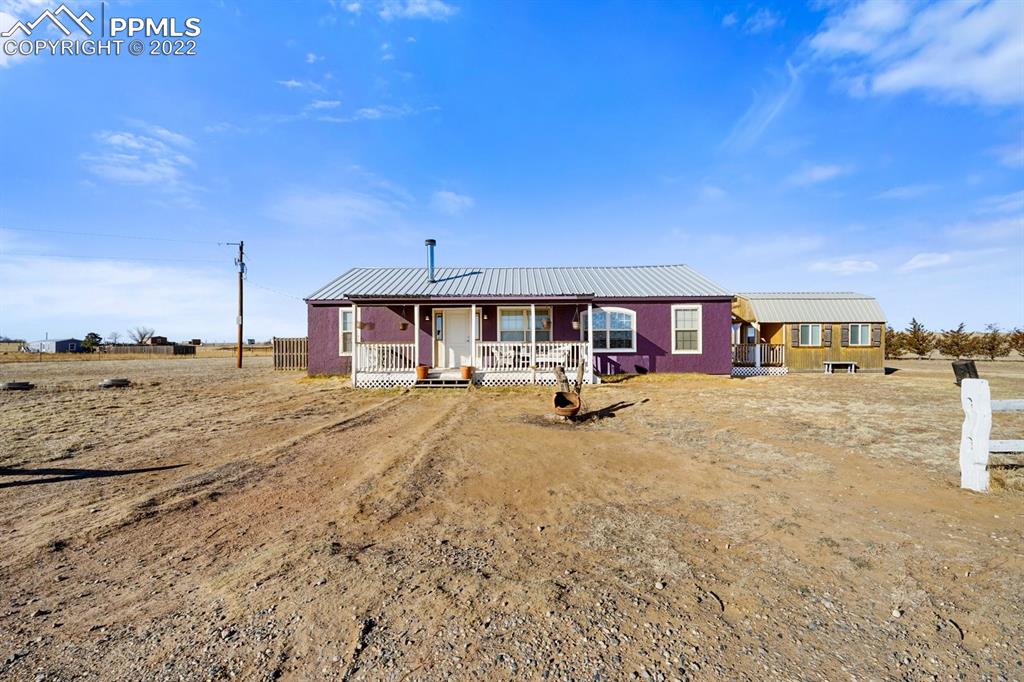 6260 Night Train Lane Yoder, CO 80864 - Photo 5 of 24 a house with trees in front of it
