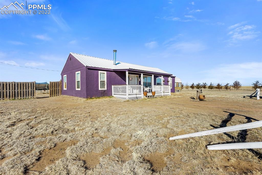 6260 Night Train Lane Yoder, CO 80864 - Photo 6 of 24 a front view of a house with a yard