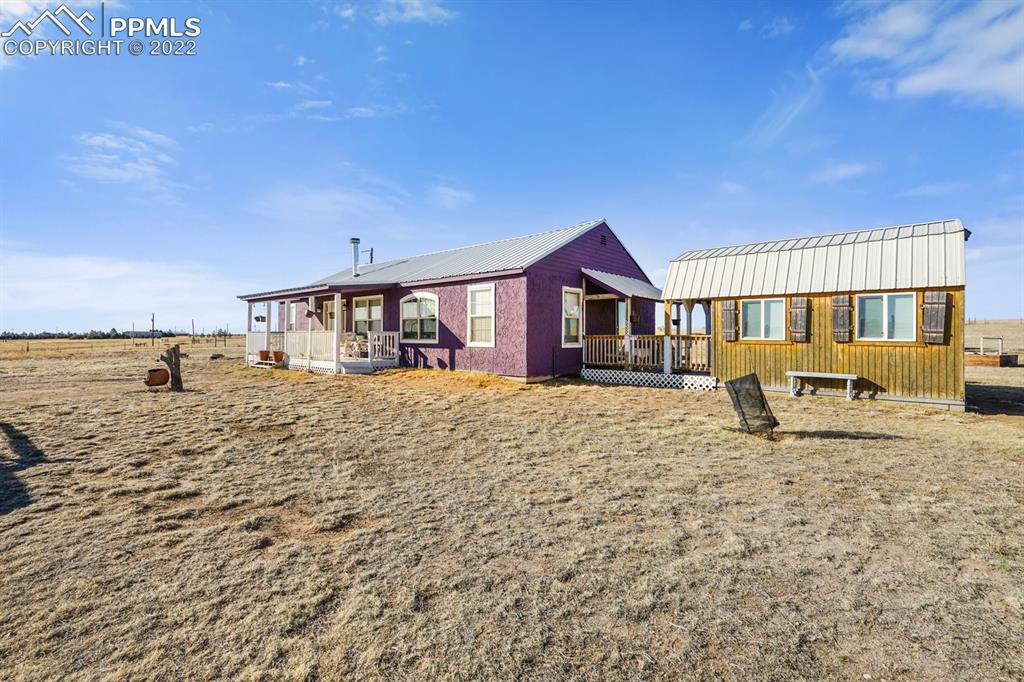6260 Night Train Lane Yoder, CO 80864 - Photo 7 of 24 a front view of a house with a yard