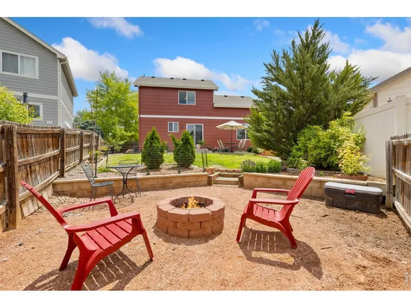 a view of a patio with couches table and chairs and potted plants