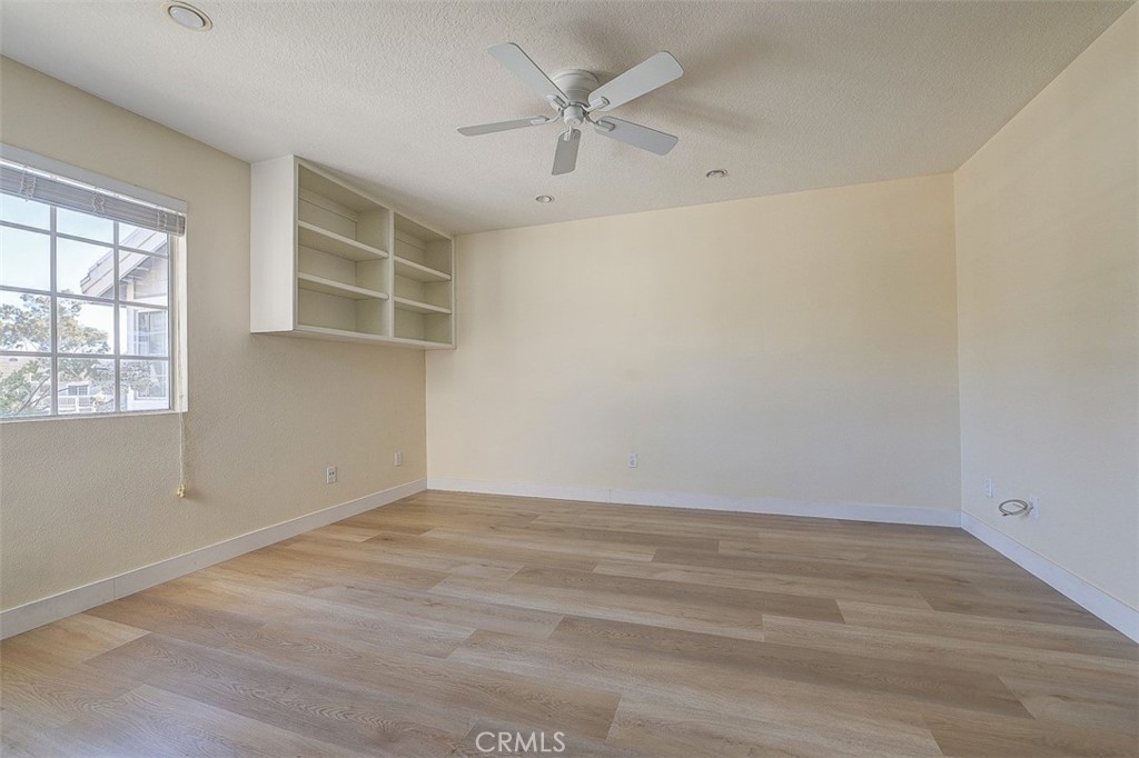 45 Campton Place Laguna Niguel, CA 92677 - Photo 17 of 22 an empty room with a windows and ceiling fan