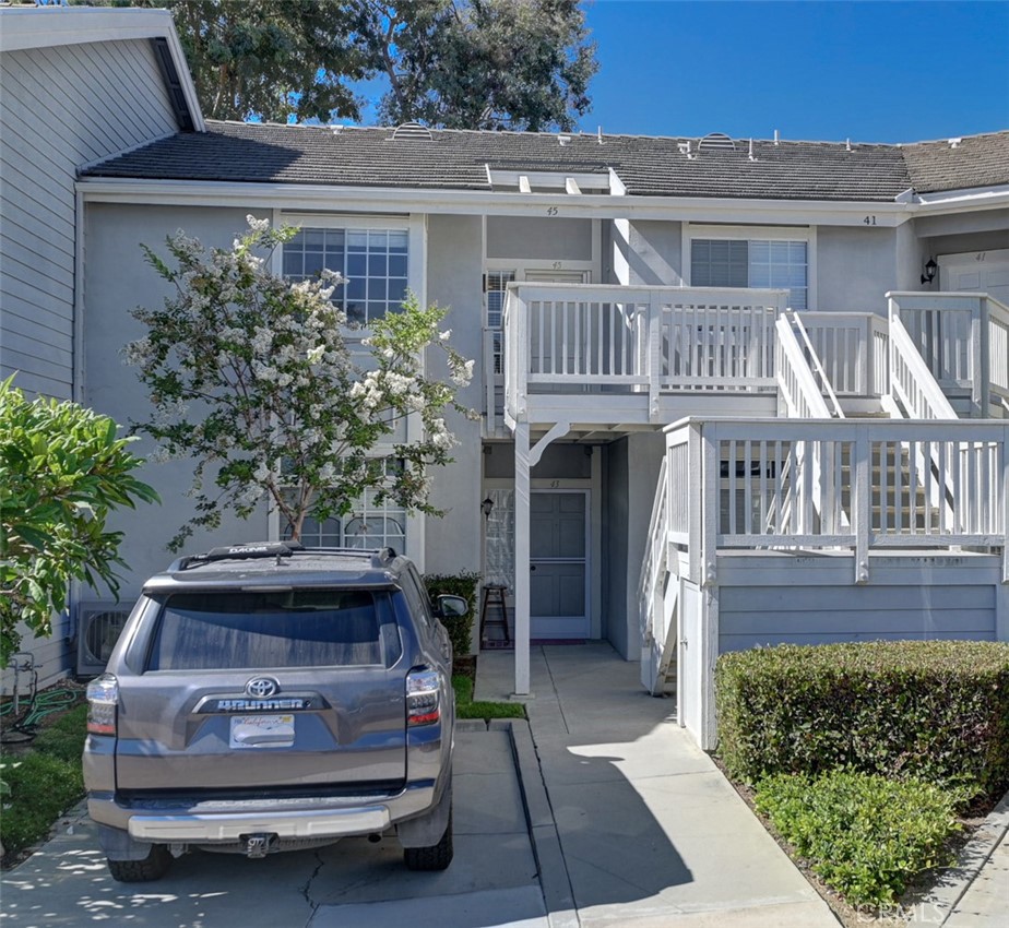 45 Campton Place Laguna Niguel, CA 92677 - Photo 22 of 22 a front view of a house with a garden