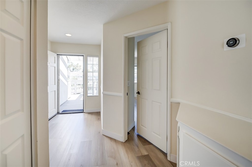 45 Campton Place Laguna Niguel, CA 92677 - Photo 4 of 22 a view of a hallway with wooden floor and closet area