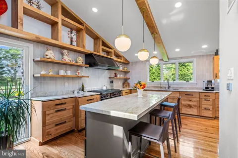 a kitchen with a table and chairs in it