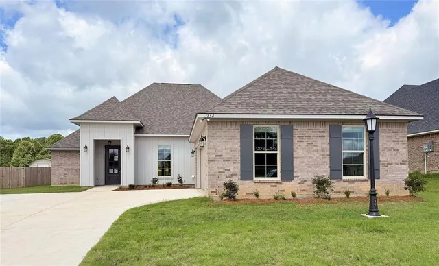 front view of a house with a yard
