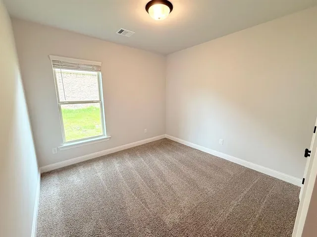 a view of storage and utility room with wooden floor