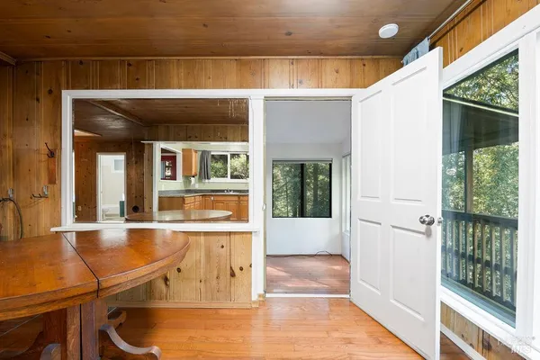 a bathroom with a tub shower sink and mirror