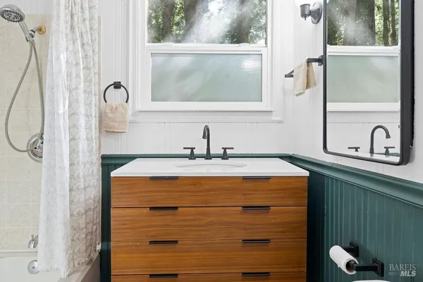 a view of a kitchen with a sink and a fireplace