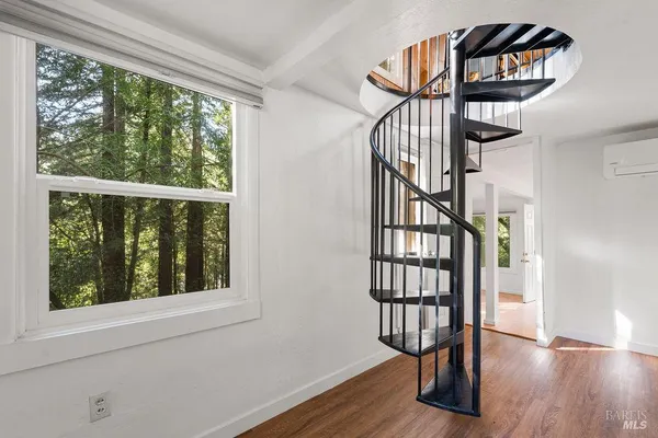 a view of a room with a large window