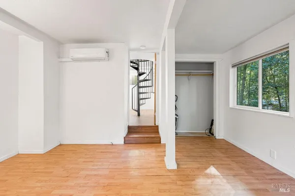 a view of storage and utility room with washer and dryer