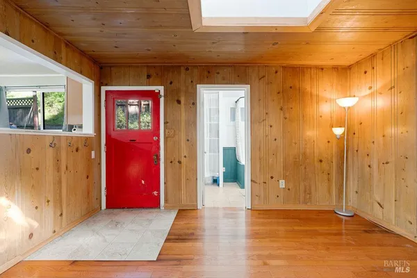 a view of a furniture wooden floor and windows