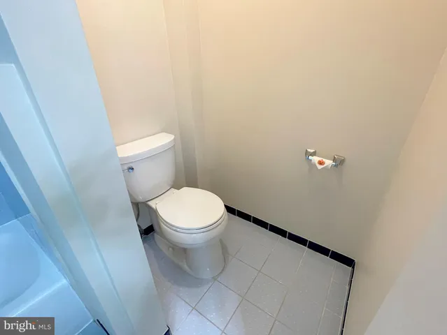 an empty room with a empty space and a window