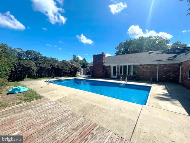 a view of a house with swimming pool