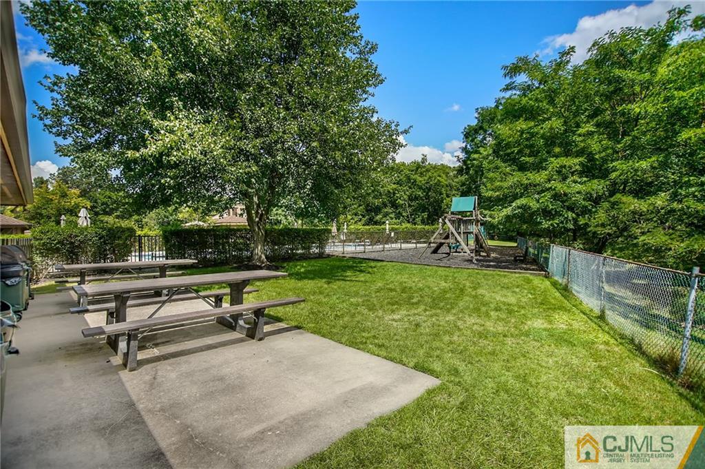 54 Holly Court Edison, NJ 08820 - Photo 24 of 25 a bench sitting in the middle of a park