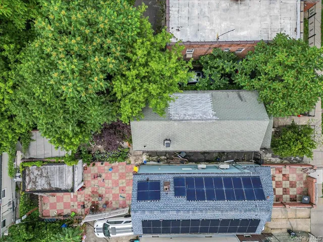 an aerial view of a house with a garden