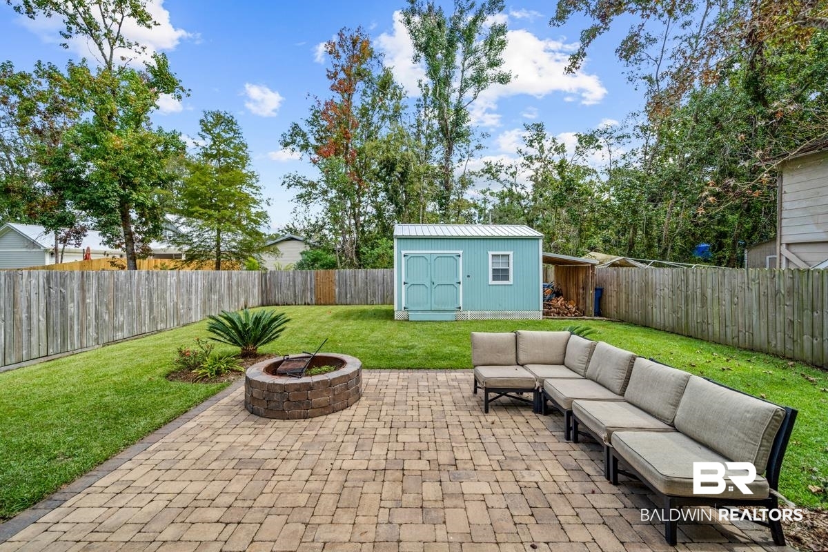 5204 Pine Road Orange Beach, AL 36561 - Photo 17 of 28 Patio with fire pit