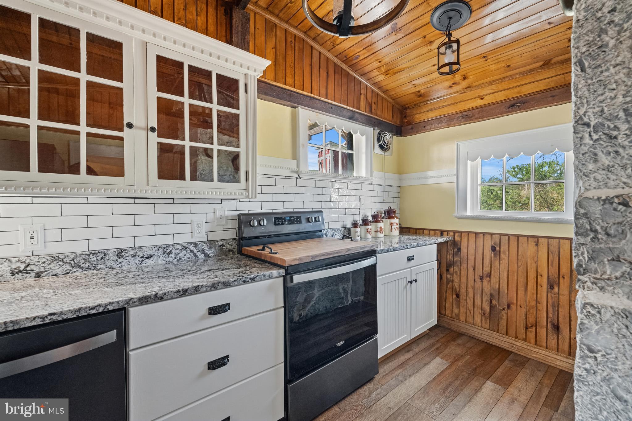 989 Swover Creek Road Edinburg, VA 22824 - Photo 40 of 132 a kitchen with a stove and cabinets