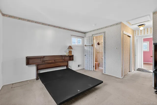 a view of room with stairs and wooden floor
