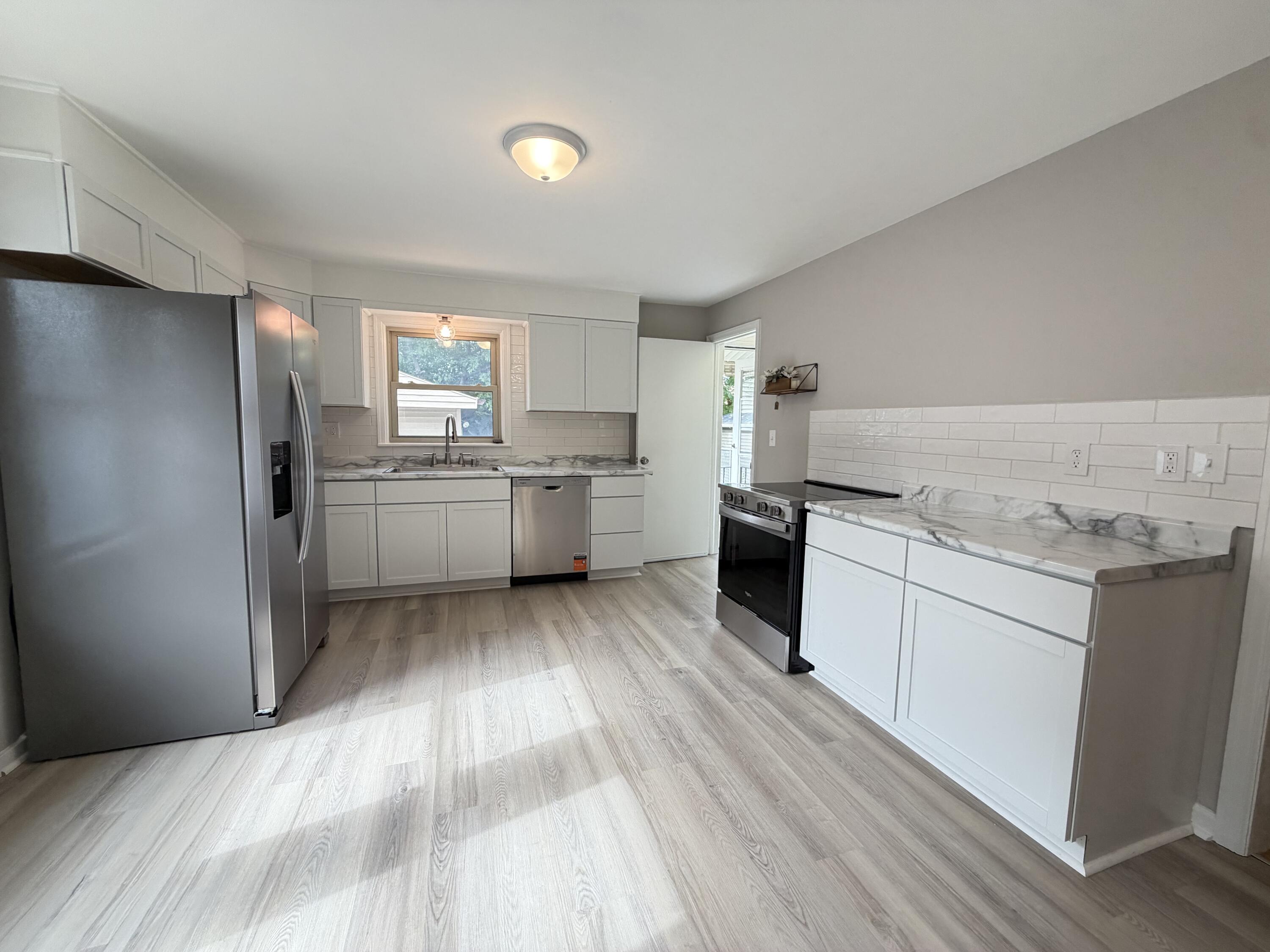 2308 West Lawn Avenue Racine, WI 53405 - Photo 8 of 21 New Kitchen w LVP