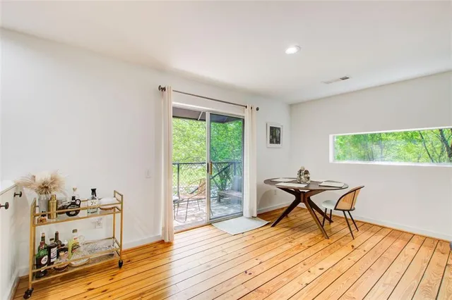 a work room with furniture and a wooden floor