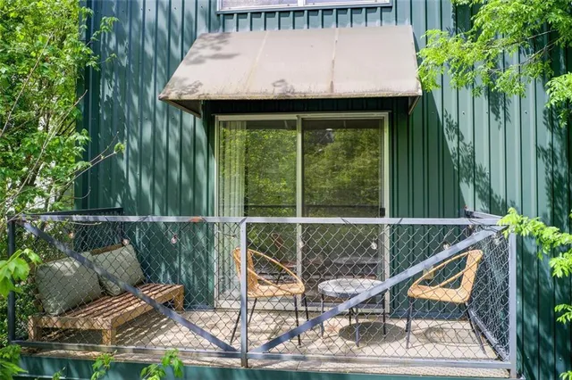 a terrace of a house with table and chairs