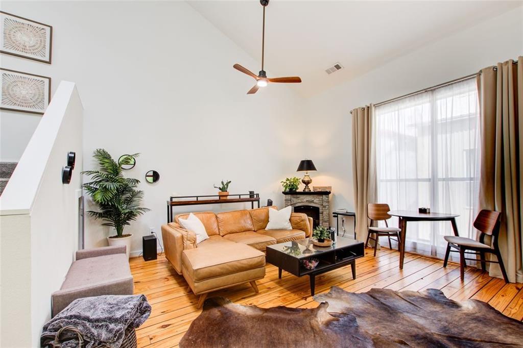 241 Maynard Terrace Southeast, Unit 7 Atlanta, GA 30316 - Photo 21 of 44 a living room with furniture and a large window