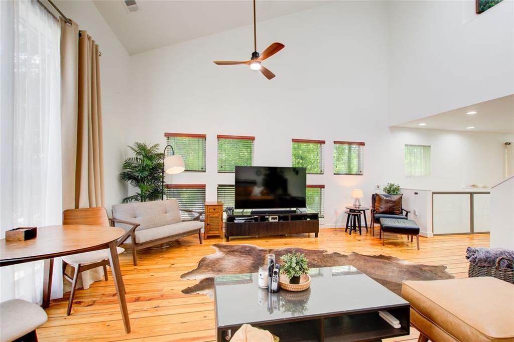 241 Maynard Terrace Southeast, Unit 7 Atlanta, GA 30316 - Photo 23 of 44 a living room with furniture and a flat screen tv
