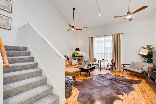 a bedroom with a bed and large window