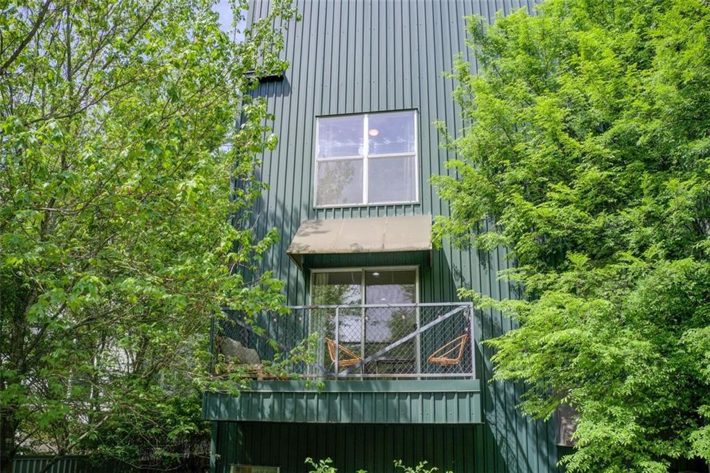241 Maynard Terrace Southeast, Unit 7 Atlanta, GA 30316 - Photo 37 of 44 an aerial view of a house with balcony and trees