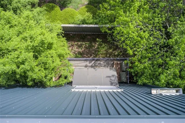 a wooden bench sitting in front of a house